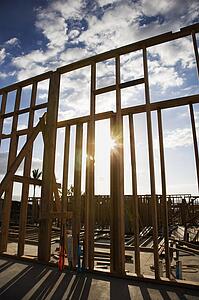 Wooden frame with sunburst in middle at construction site