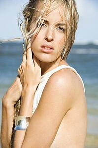 Blond woman on beach.