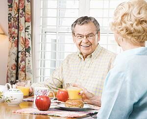 Senior couple having breakfast together