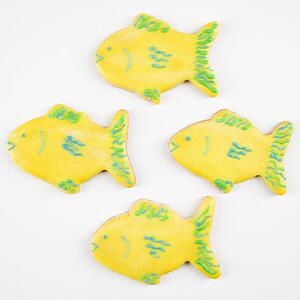 Four fish shaped sugar cookies with decorative icing.