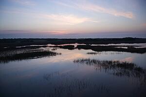 Sky reflecting water in marsh area on Bald Head Island, North Carolina