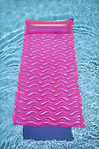 Pink lounge float in empty swimming pool with rippling blue water.