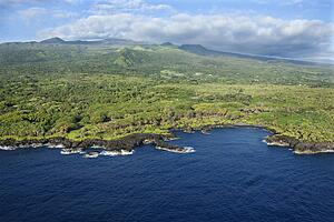 Aerial of Maui, Hawaii coastline with mountains in background