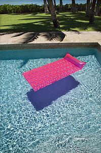 Pink float in empty swimming pool.
