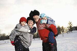 Parents carrying son and daughter