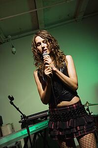 Female singing into microphone