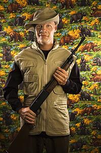 Mid-adult male holding a rifle.