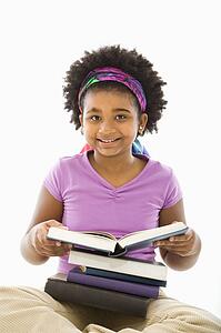 Girl with large stack of books