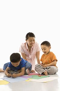 Mother with boys coloring