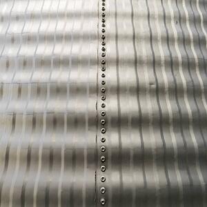 Close up view of metal silo siding texture.