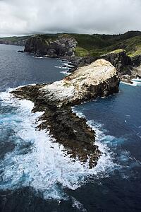 Aerial view of rocky cliffs on coastline of Maui, Hawaii.