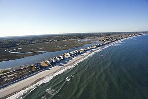Aerial view of houses in row on beachfront of Pawleys Island, South Carolina.