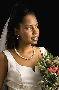 Portrait of a bride on black background