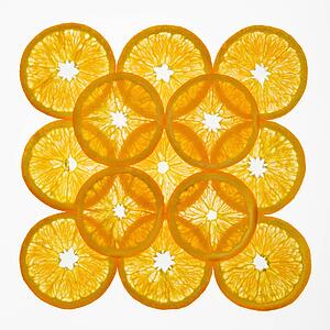 Orange slices arranged in square design on white background.