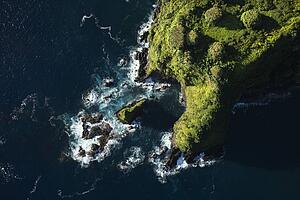 Aerial of rocky coast on Pacific ocean in Maui, Hawaii.