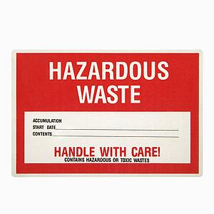 Hazardous waste sign against white background.