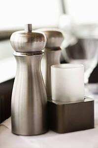 Stainless steel salt and pepper shaker.