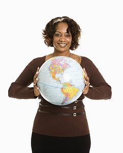 Smiling woman holding earth globe