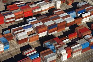 Aerial view of cargo containers piled together. 