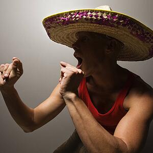 Male wearing sombrero snapping fingers