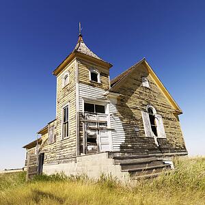 Scenic of old abandoned church in field