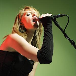Female singing into a microphone