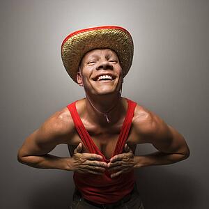 Male wearing stray hat and touching his chest