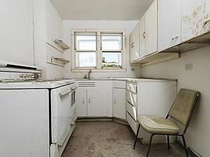 Empty abandoned dirty kitchen