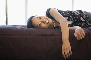 Female lying on bed