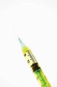 Hypodermic needle on white background.