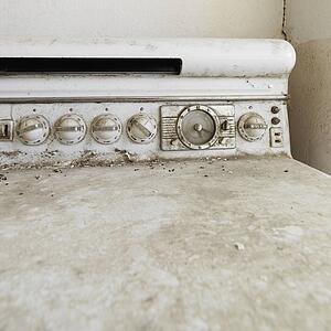 Close up of dirty old antique stove.