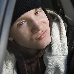 Male teenager with a smirk
