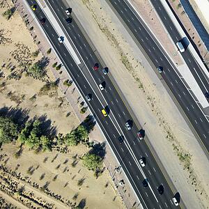 Aerial of Arizona highway with automobiles