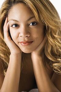 Head and shoulder portrait of pretty young woman.