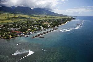 Aerial view of buildings and marina on coastline of Maui, Hawaii