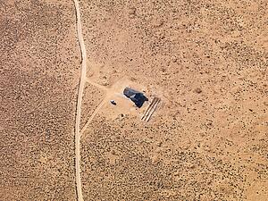 Aerial of house in remote area of Arizona desert