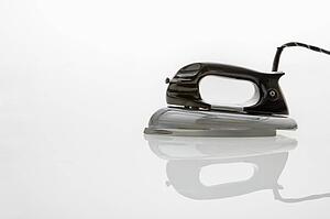 Retro iron on white background.