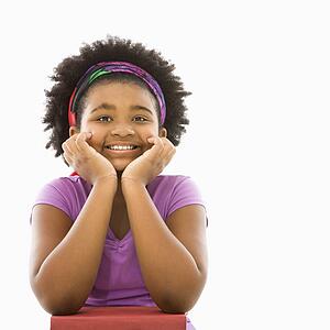Girl with head resting on hands 