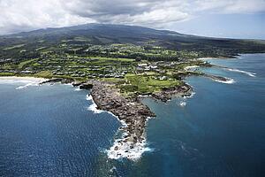 Aerial view of buildings on coastline of Maui, Hawaii.