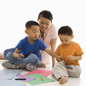 Mother with boys coloring