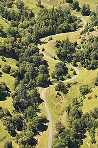 Aerial of road curving through rural landscape