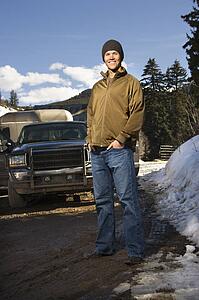 Man standing in front of truck