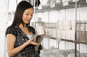 Female shopping for dishes and glasses 