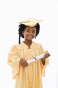 Girl in graduation robe and hat holding diploma