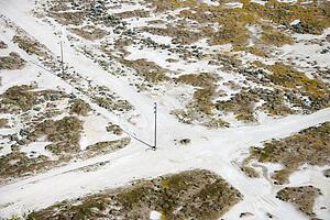 Aerial of dirt road crossroads in rural landscape, California
