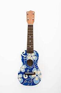 Ukulele painted with blue flowers in Hawaiian pattern.