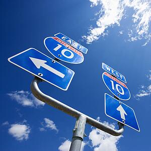 Highway interstate 10 sign with arrows showing direction.