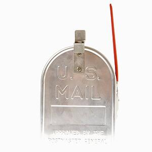 Shiny silver metal mailbox with flag up