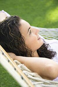 Lying in hammock smiling