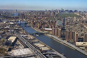 Aerial view of Harlem River and bridges with the Bronx and Manhattan buildings in New York City